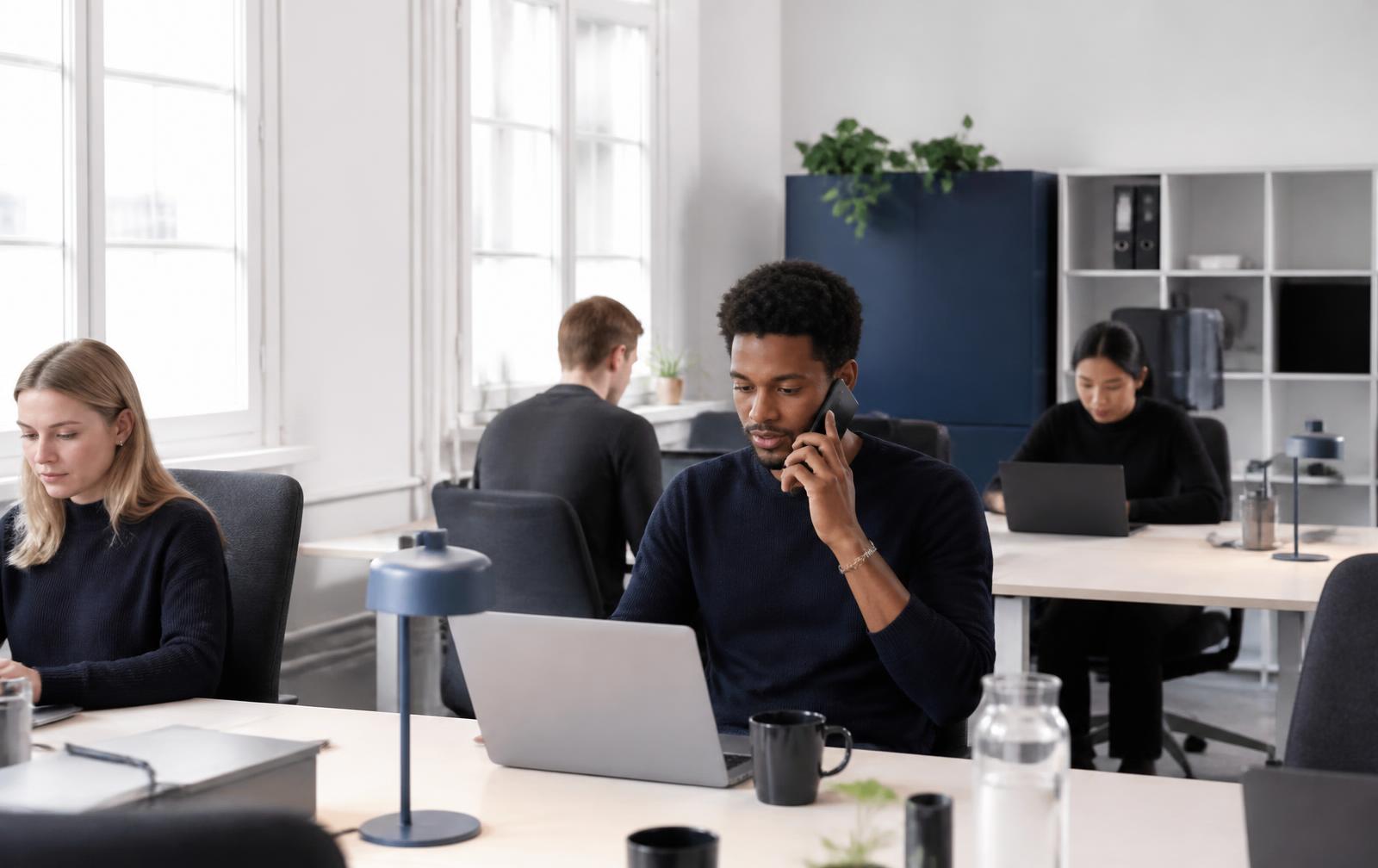 Colleagues working with focus in a modern office